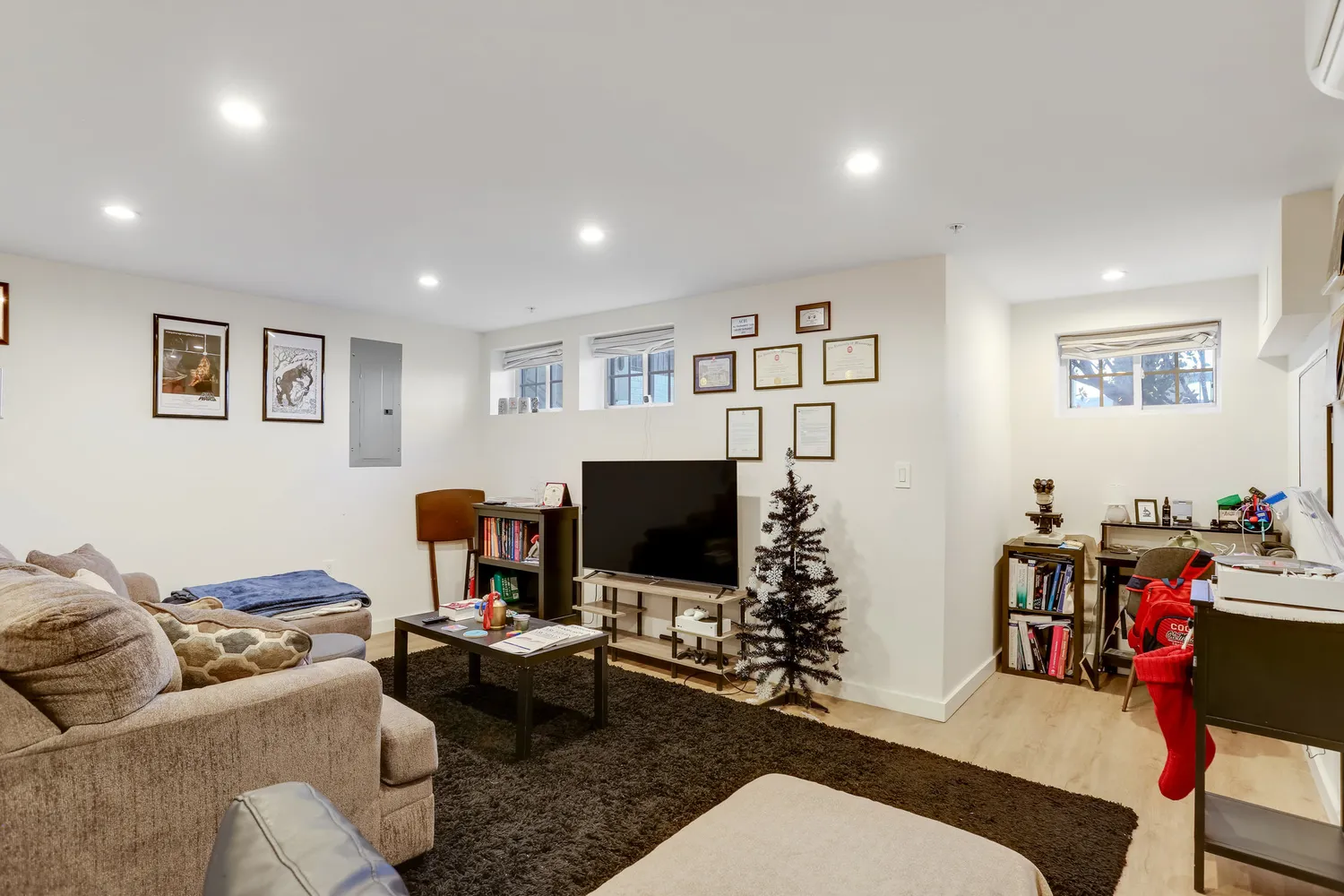 a bedroom with a bed and a television