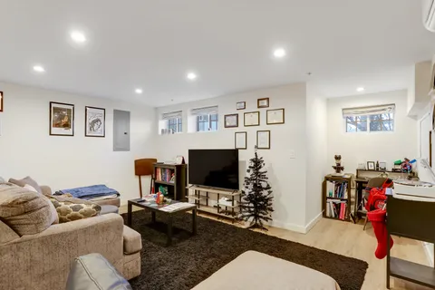 a bedroom with a bed and a television