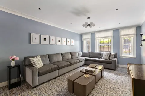 a bathroom with a toilet and a mirror