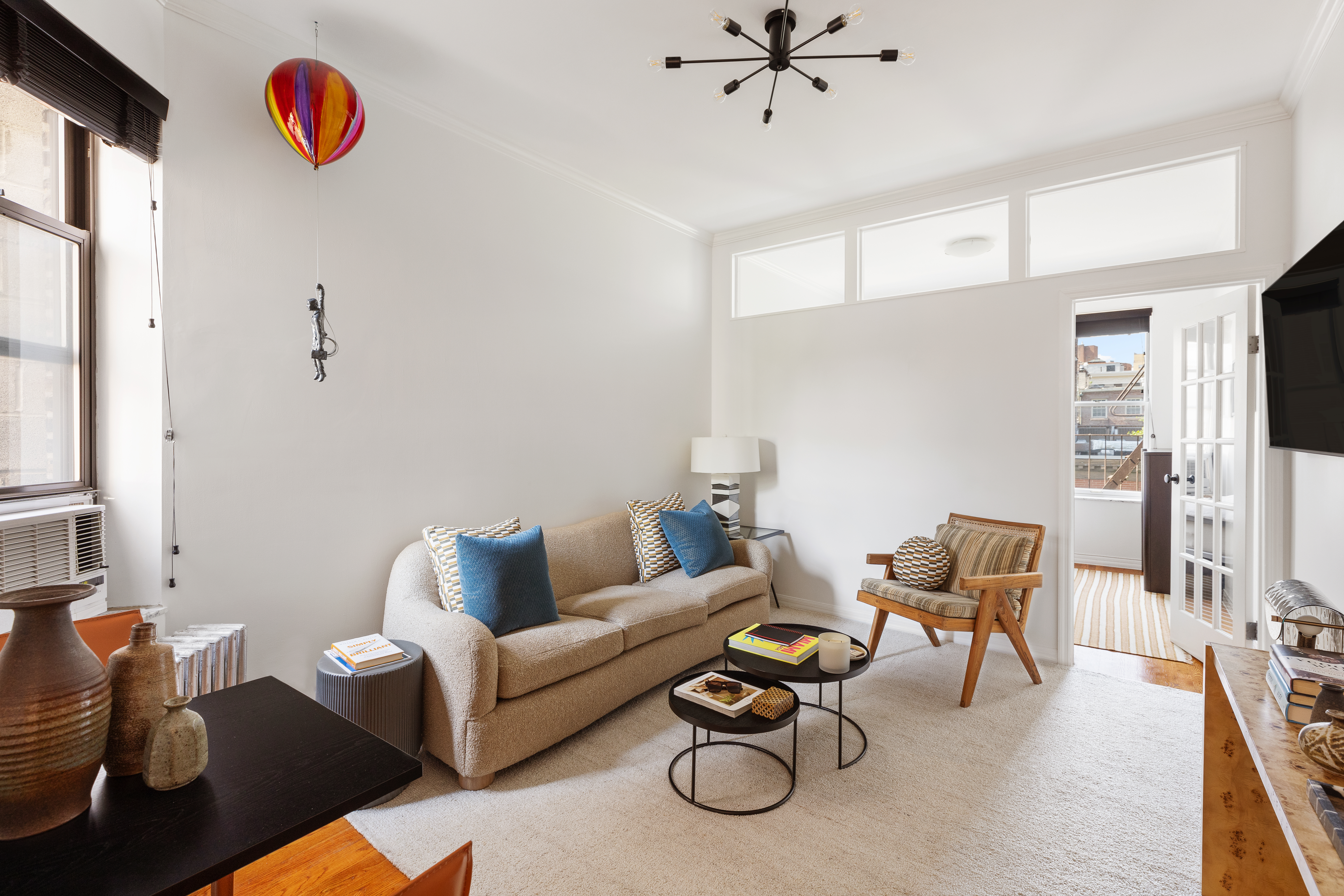 28 Perry Street, Unit 4W Manhattan, NY 10014 - Photo 2 of 7 a living room with furniture and a rug