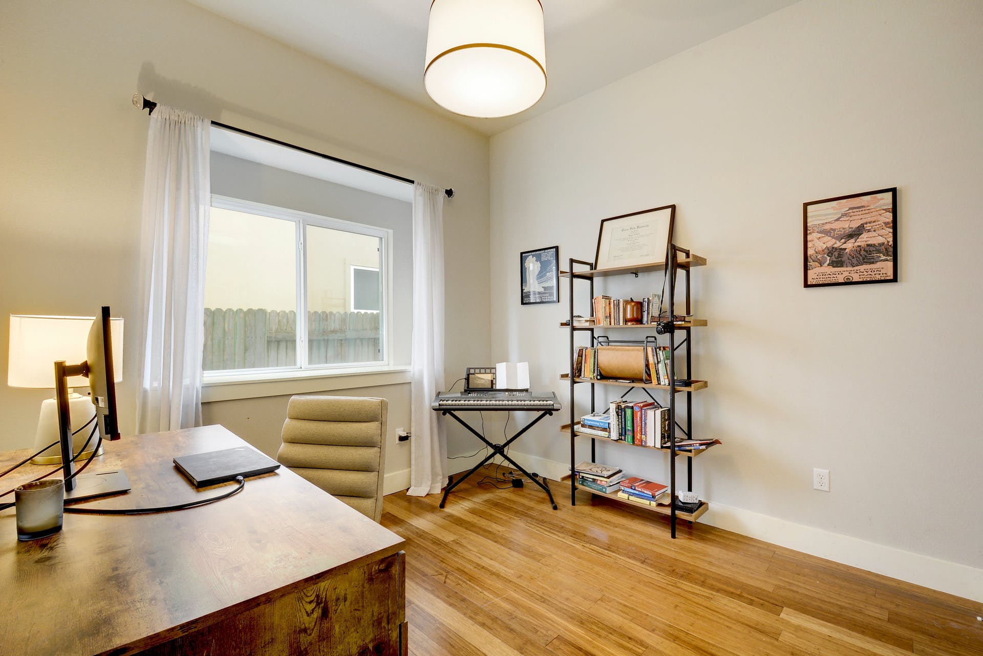 5400 Daimler Drive Austin, TX 78744 - Photo 19 of 27 a view of a workspace with furniture and a window