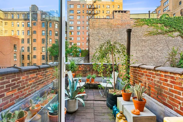 a balcony with outdoor seating