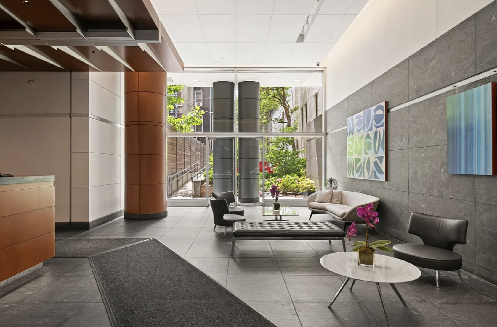 360 East 88th Street, Unit 34A Manhattan, NY 10128 - Photo 26 of 35 a living room with furniture and a potted plant
