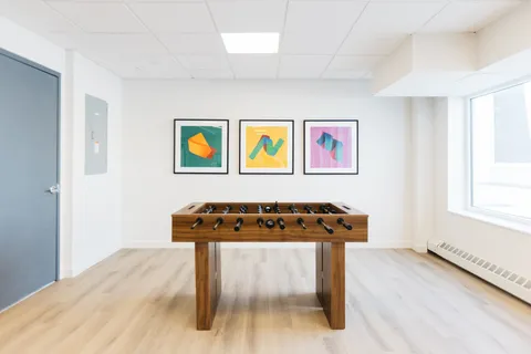 a room with furniture and painting on wall