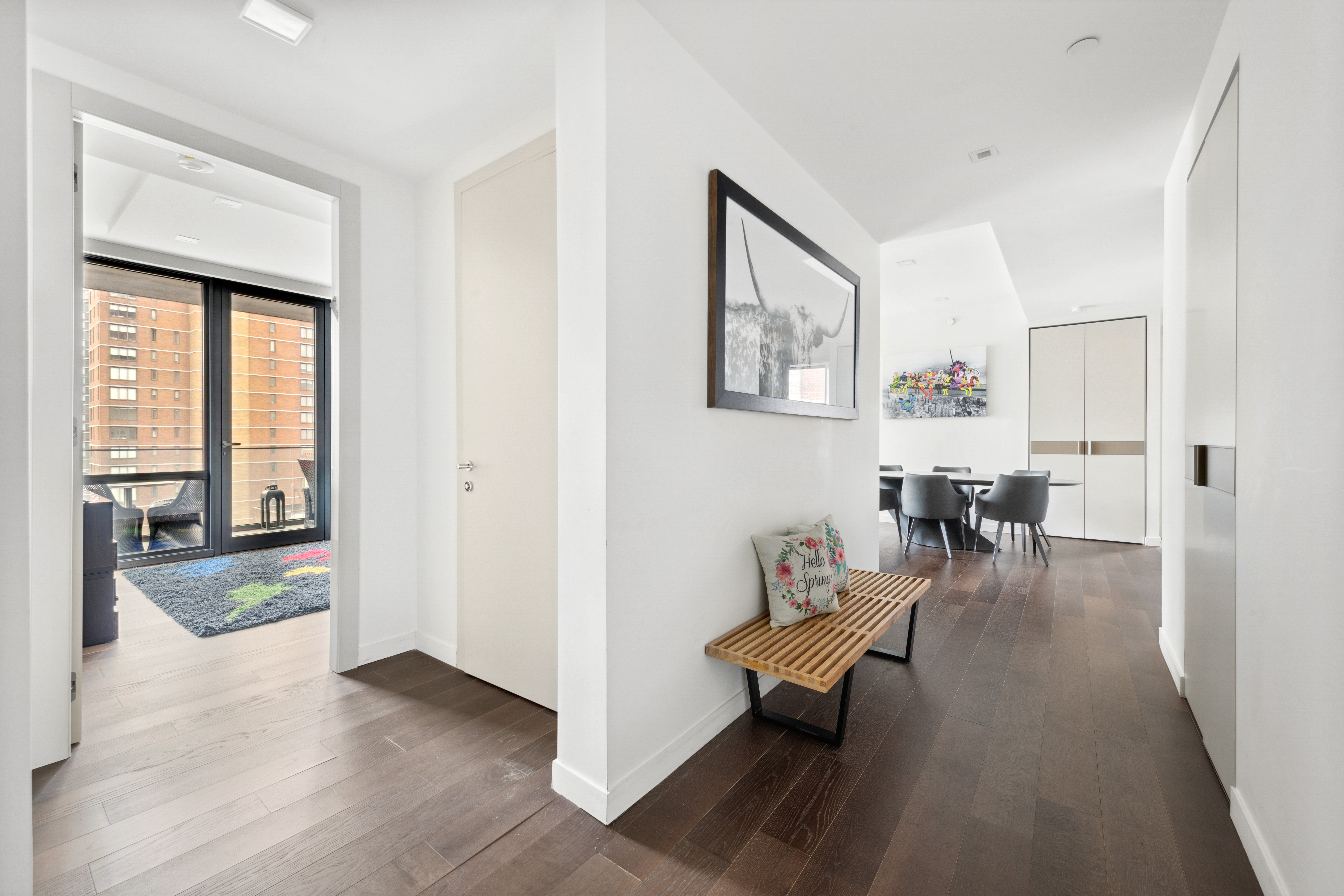 302 East 96th Street, Unit 1302 Manhattan, NY 10128 - Photo 10 of 17 a living room with furniture and a table