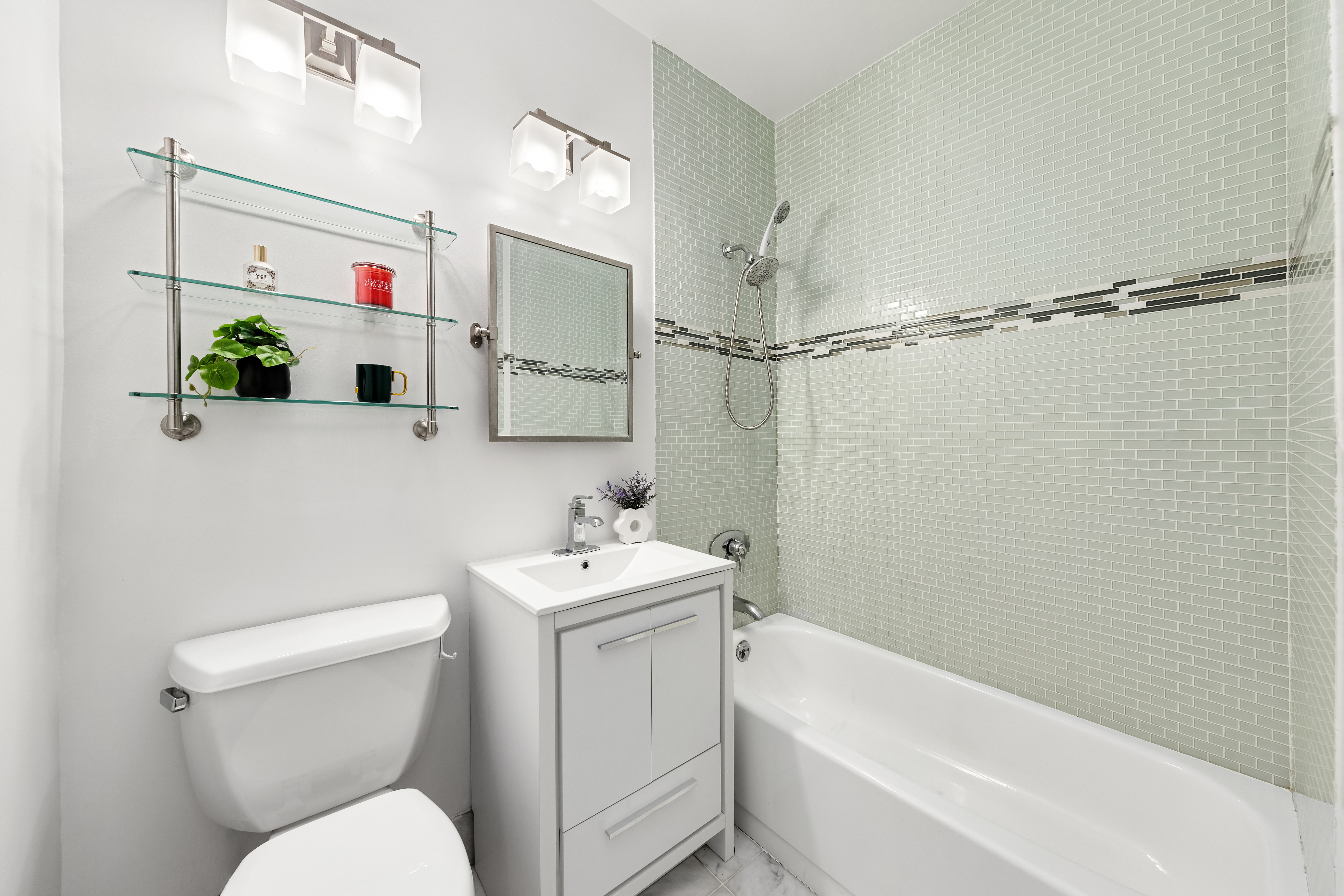 3 Hanover Square, Unit 8E Manhattan, NY 10004 - Photo 5 of 7 a bathroom with a toilet sink and shower