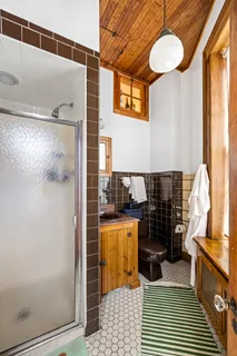 a bathroom with a bathtub and a shower