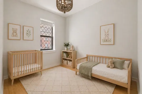 a bedroom with furniture and baby crib