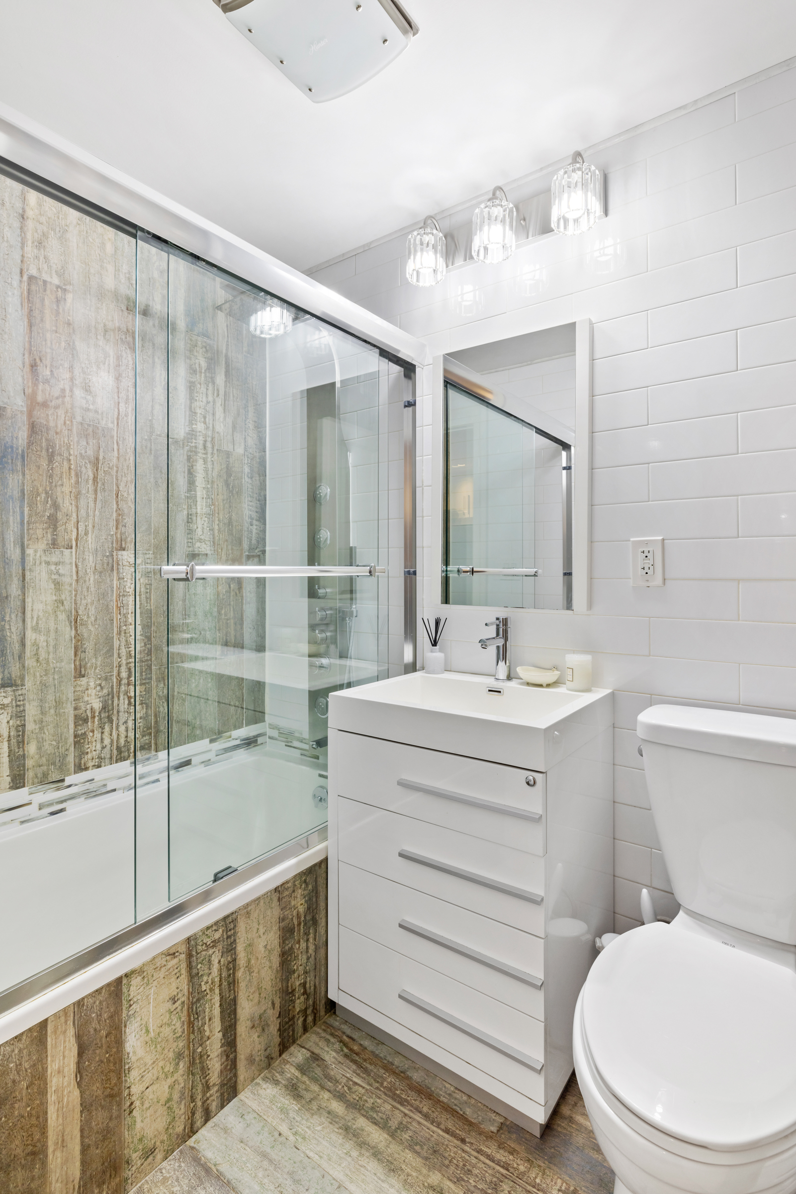 439 A Monroe Street Brooklyn, NY 11221 - Photo 22 of 29 a bathroom with a sink a toilet and shower