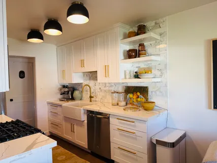 a kitchen with a sink and cabinets