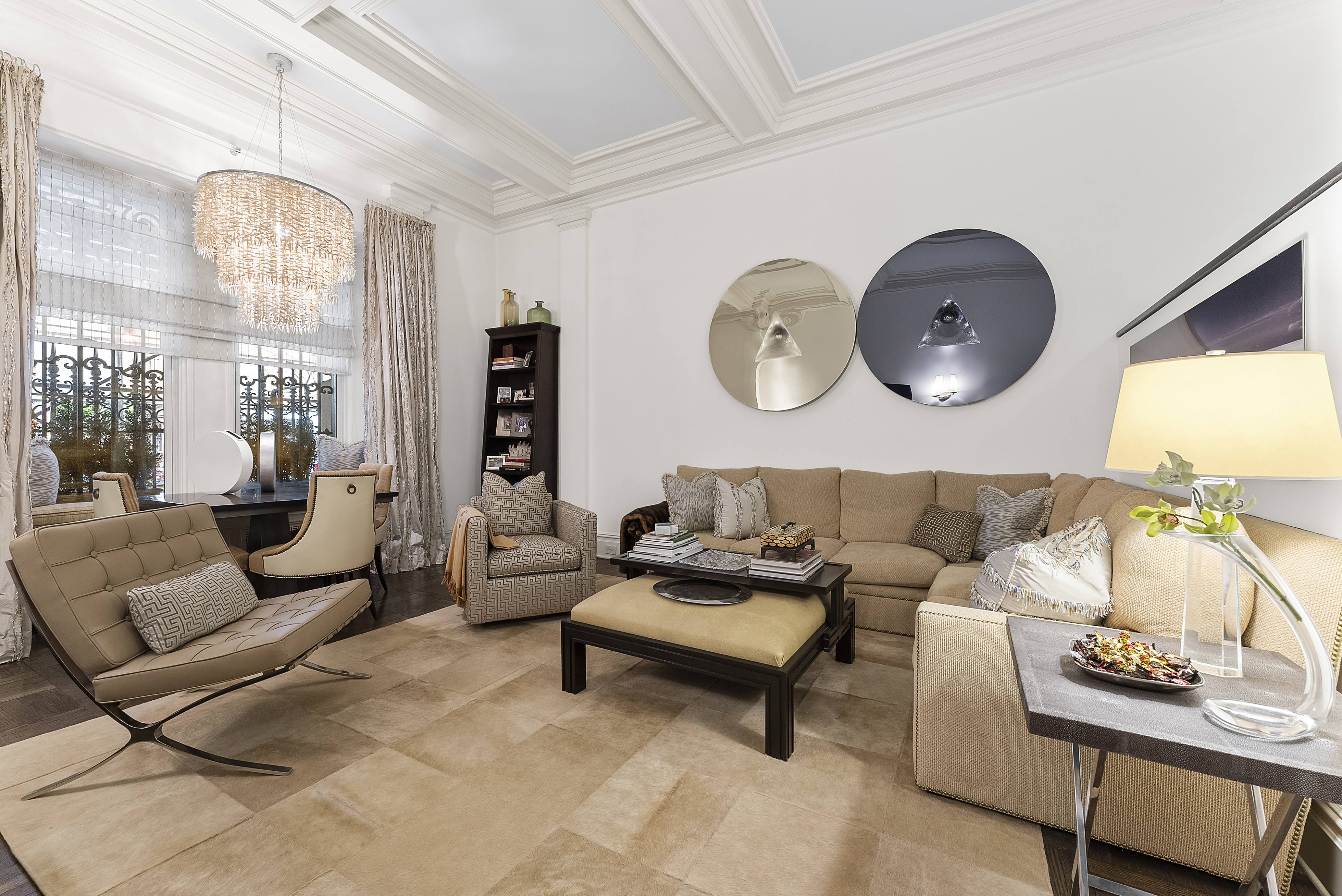 3 East 75th Street, Unit 1C Manhattan, NY 10021 - Photo 1 of 7 a living room with furniture and a large window