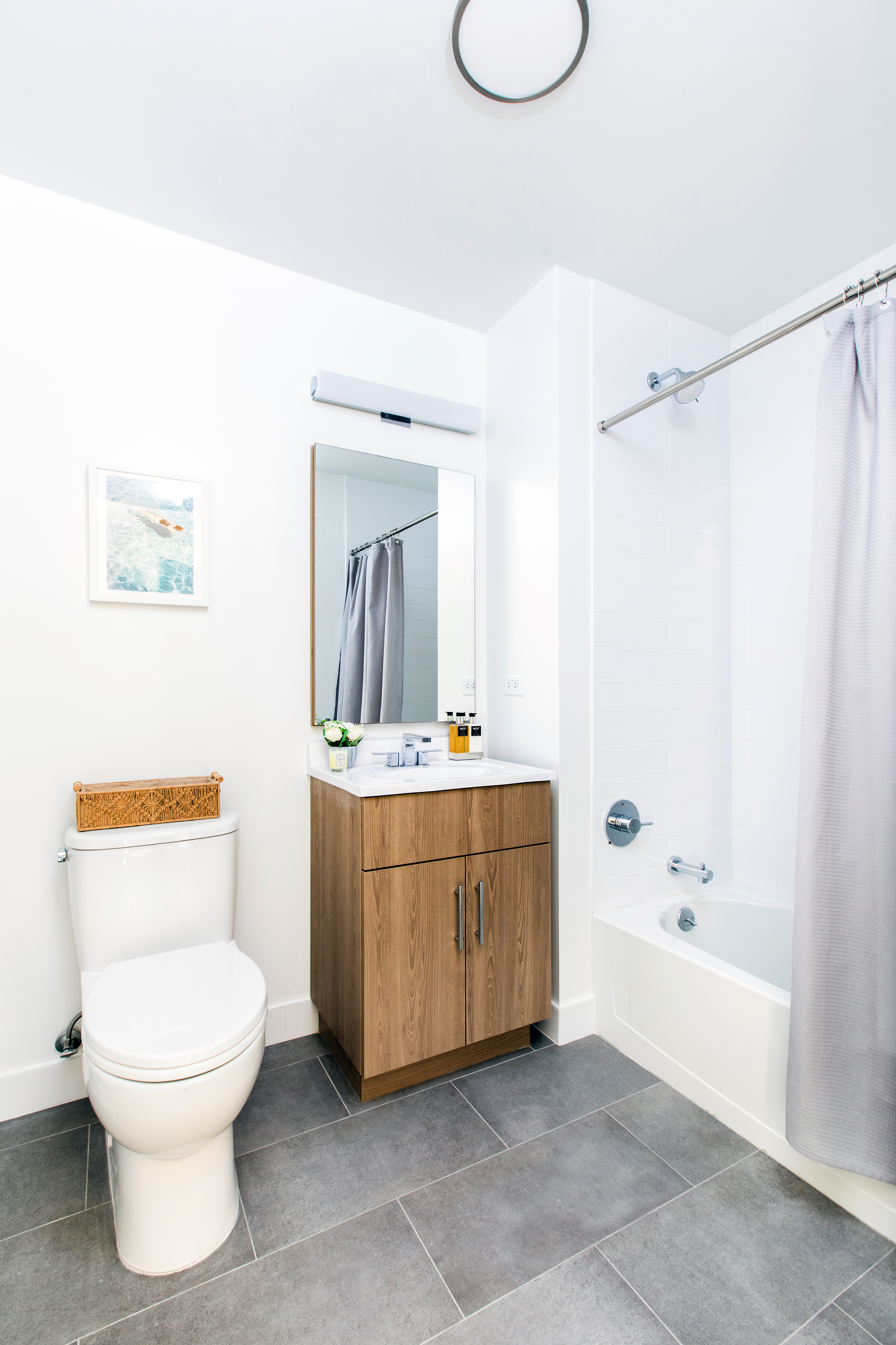 8 Palmetto Street, Unit 305 Brooklyn, NY 11221 - Photo 4 of 20 a bathroom with a toilet a sink and a bathtub