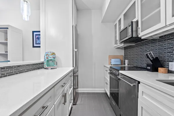a kitchen with a sink and cabinets