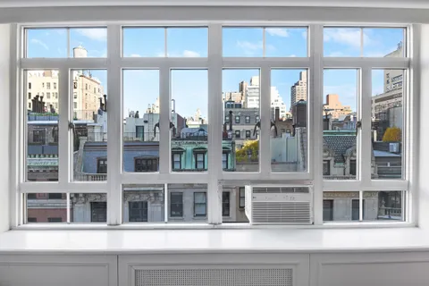 a bathroom with a granite countertop toilet a sink and shower