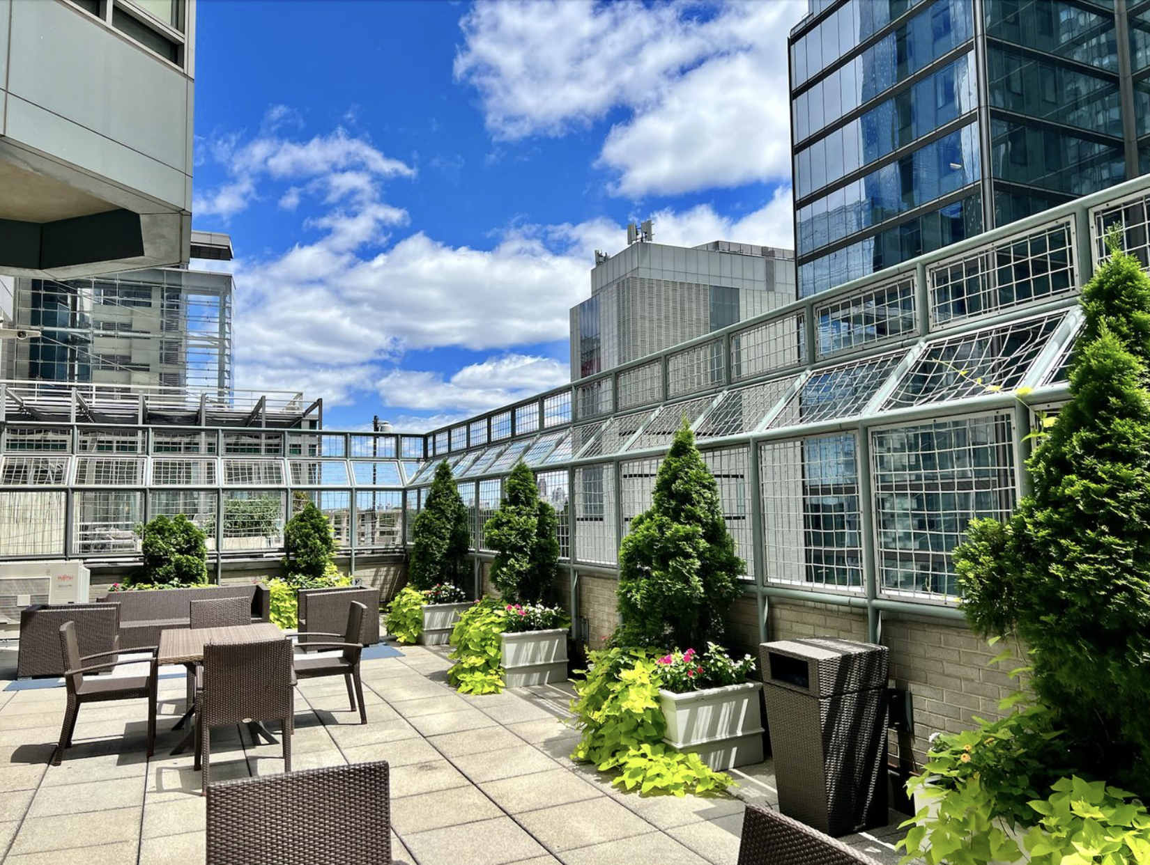 301 West 57th Street, Unit 3E Manhattan, NY 10019 - Photo 9 of 13 a view of a patio with couches table and chairs and potted plants