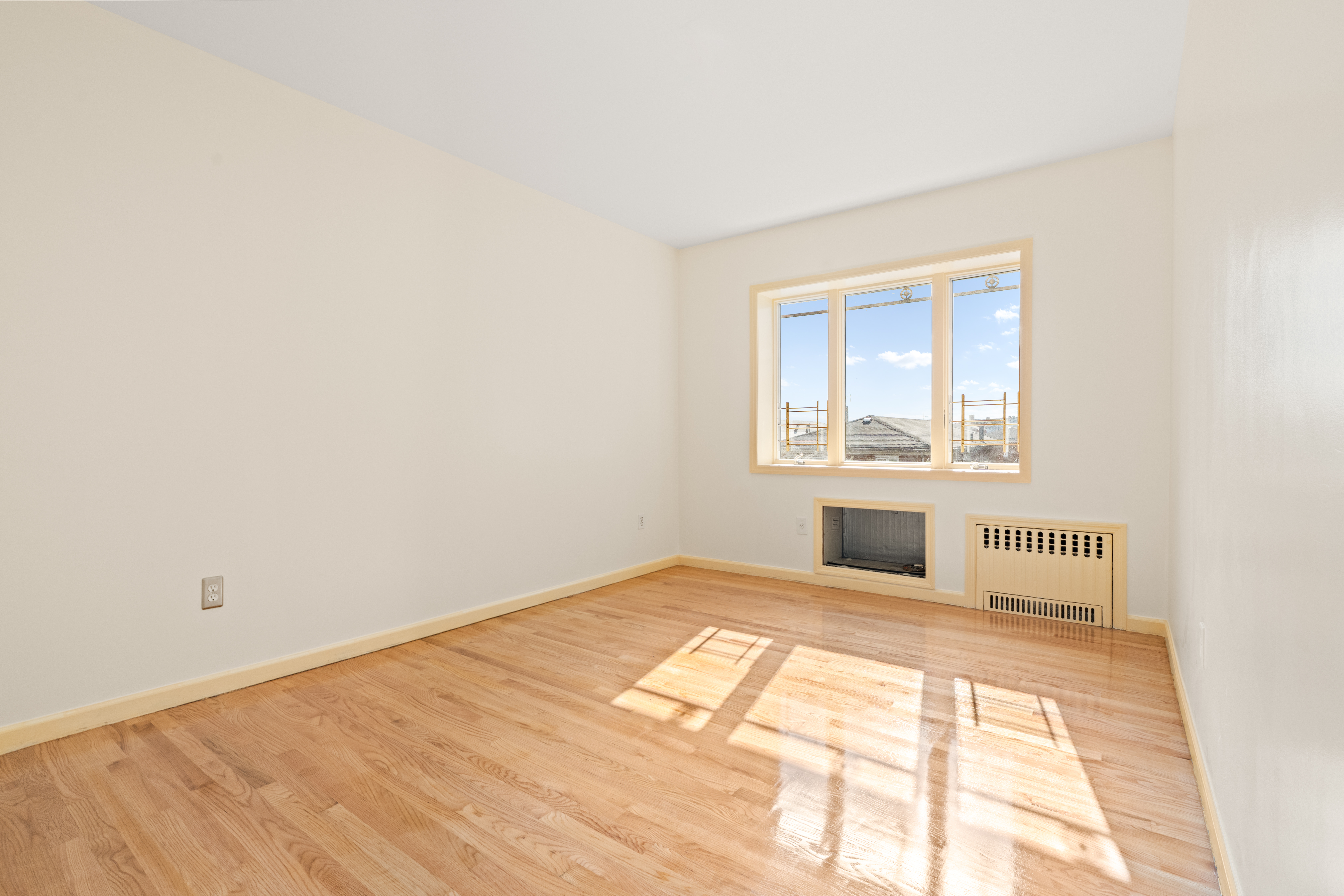 1920 83rd Street, Unit 3 Brooklyn, NY 11214 - Photo 5 of 9 a view of an empty room with a window