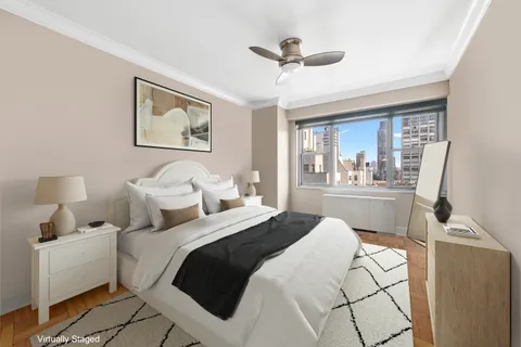 a bedroom with a white bed and white walls