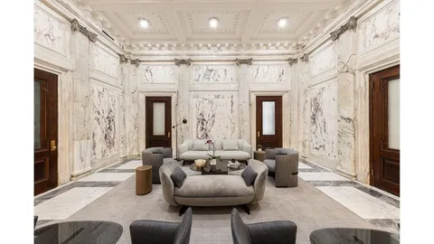 a living room with furniture and a glass door