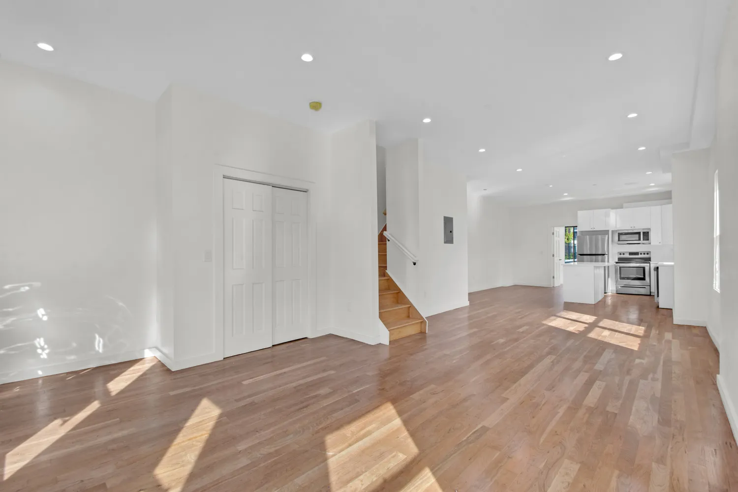 a view of kitchen and wooden floor