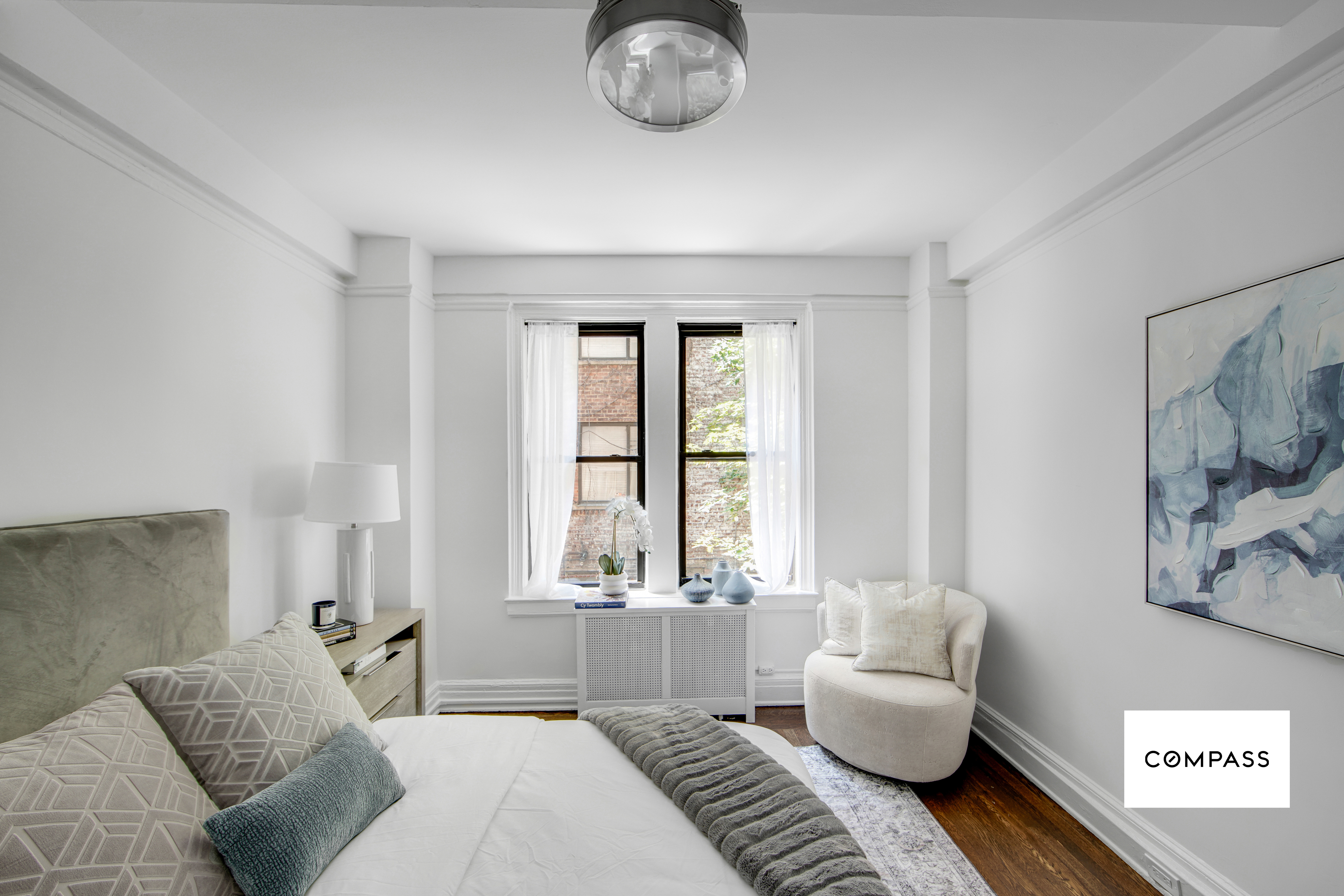 124 East 84th Street, Unit 1D Manhattan, NY 10028 - Photo 8 of 14 a living room with furniture and a large window