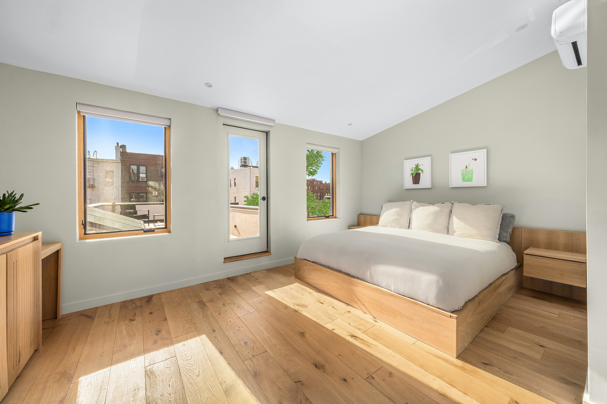 683 Leonard Street Brooklyn, NY 11222 - Photo 13 of 25 a bedroom with a bed and wooden floor