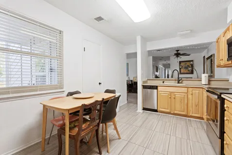 a kitchen with stainless steel appliances a stove a microwave and cabinets