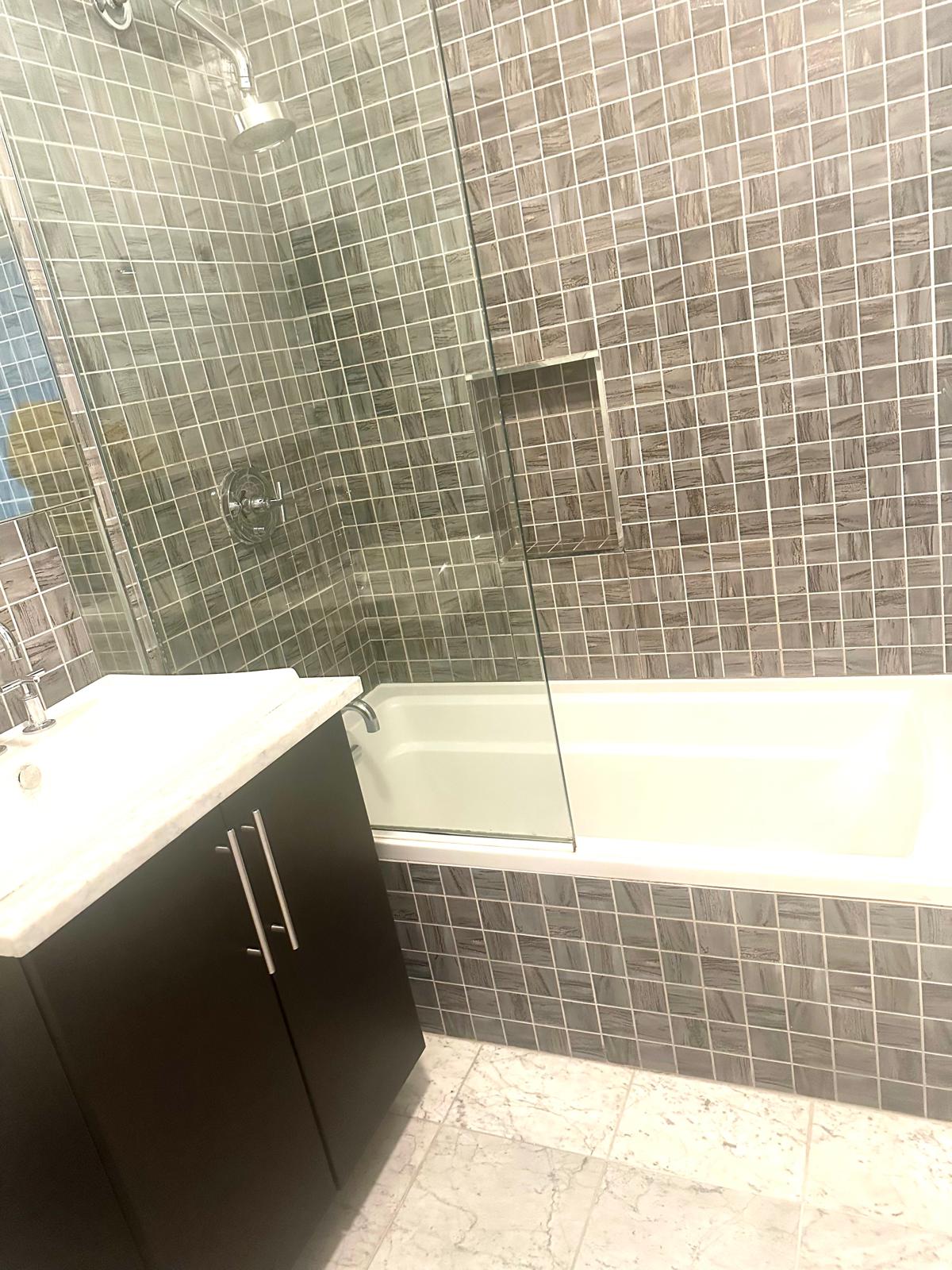 221 West 148th Street, Unit 4A Manhattan, NY 10039 - Photo 8 of 11 a bathroom with a bathtub and shower