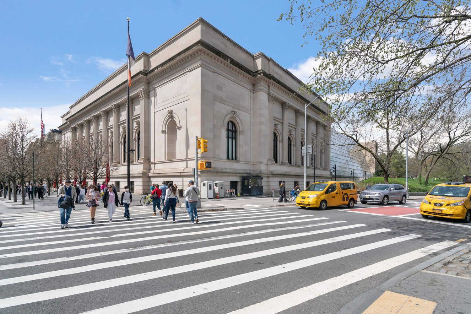 25 East 86th Street, Unit 3C Manhattan, NY 10028 - Photo 11 of 15 a group of people sitting on a street in front of a building