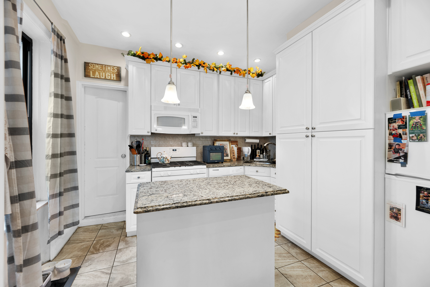 571 8th Street Brooklyn, NY 11215 - Photo 3 of 13 a kitchen with stainless steel appliances granite countertop a sink and a refrigerator