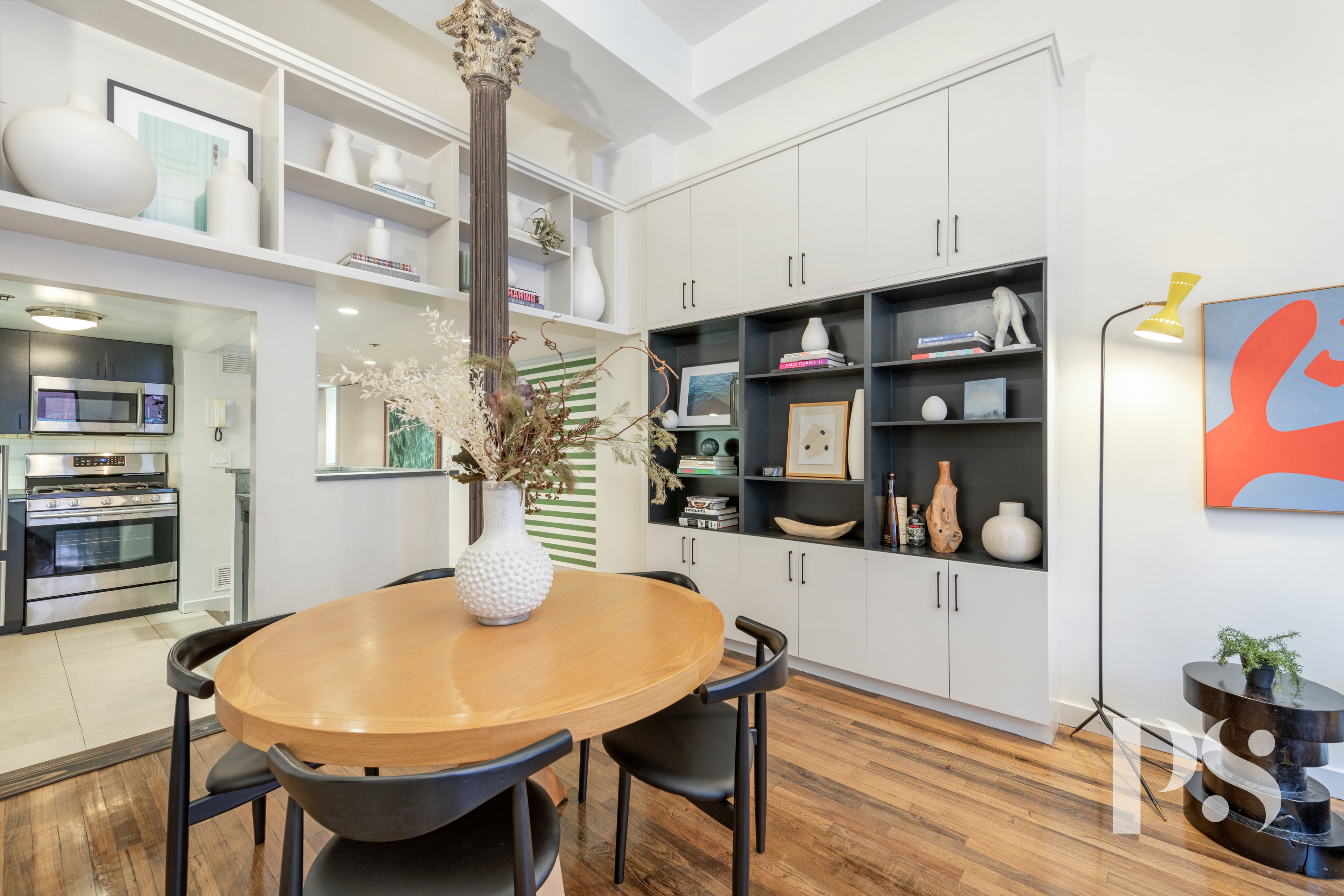 67 East 11th Street, Unit 517 Manhattan, NY 10003 - Photo 4 of 13 a view of a dining room with furniture and wooden floor
