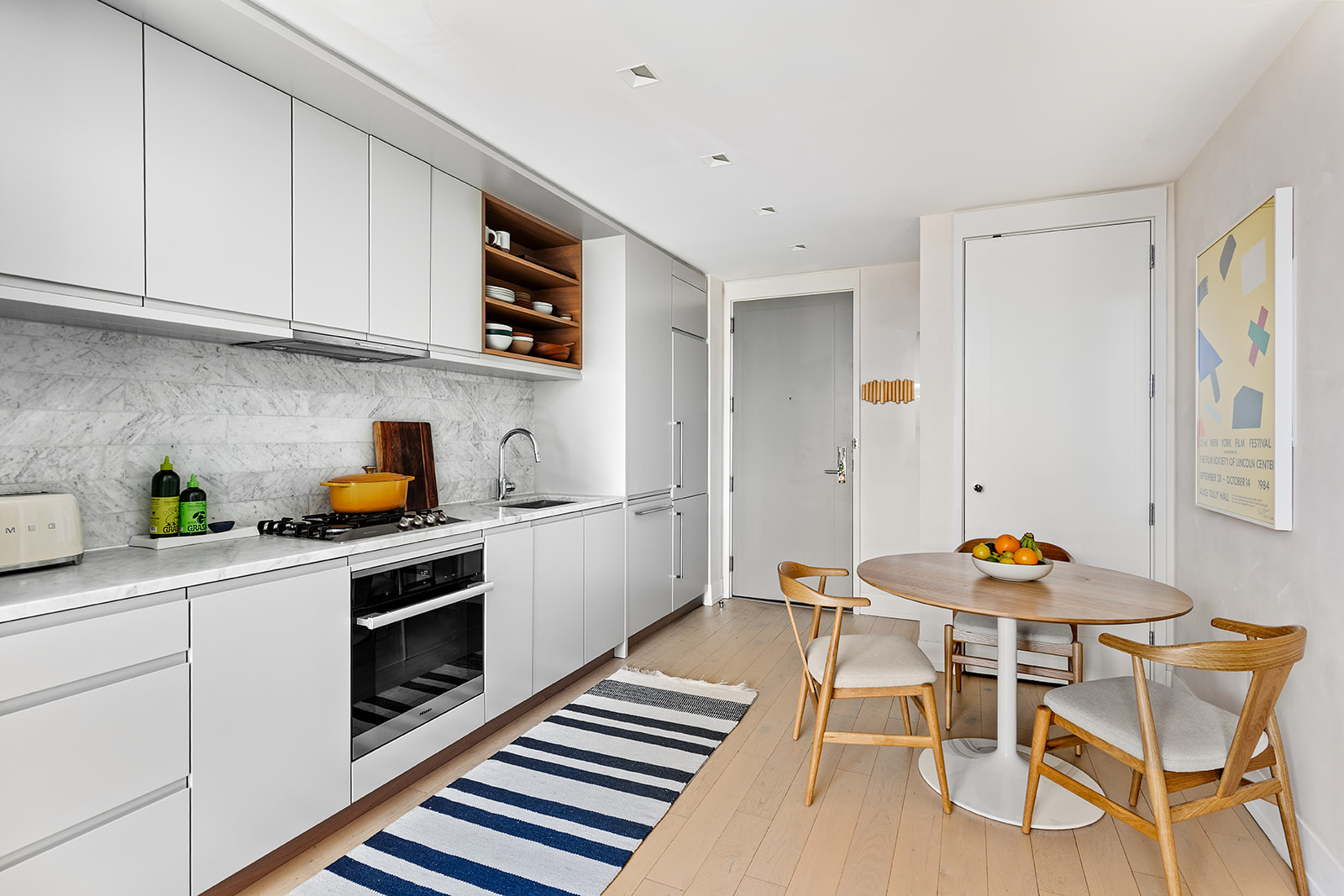 550 Vanderbilt Avenue, Unit 803 Brooklyn, NY 11238 - Photo 4 of 14 a kitchen with stainless steel appliances a stove a sink and a refrigerator