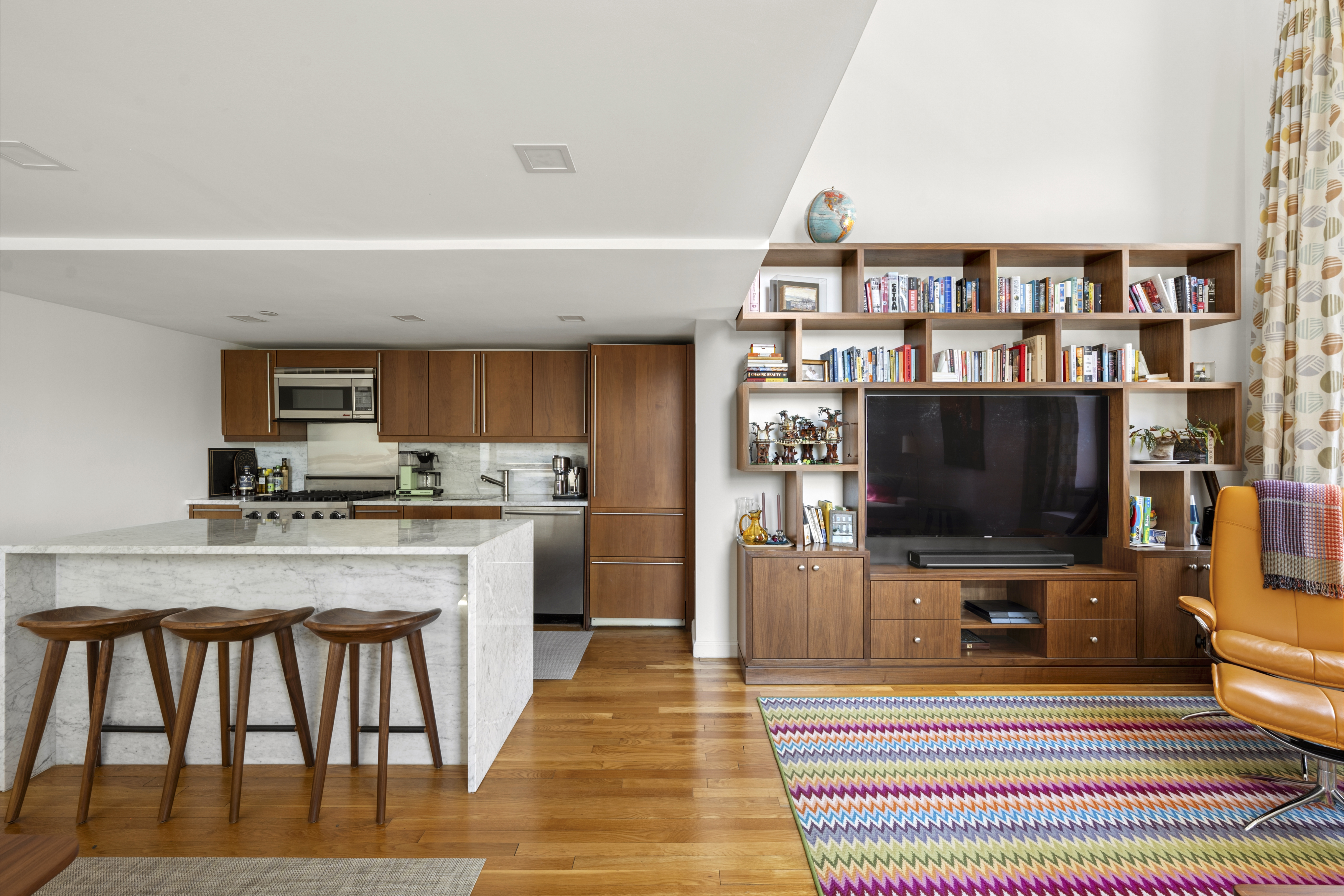 305 2nd Avenue, Unit 325 Manhattan, NY 10003 - Photo 4 of 22 a living room with furniture and a flat screen tv