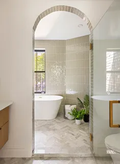 a bathroom with a bathtub and sink