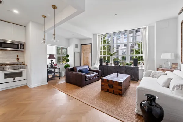 a living room with furniture and a large window