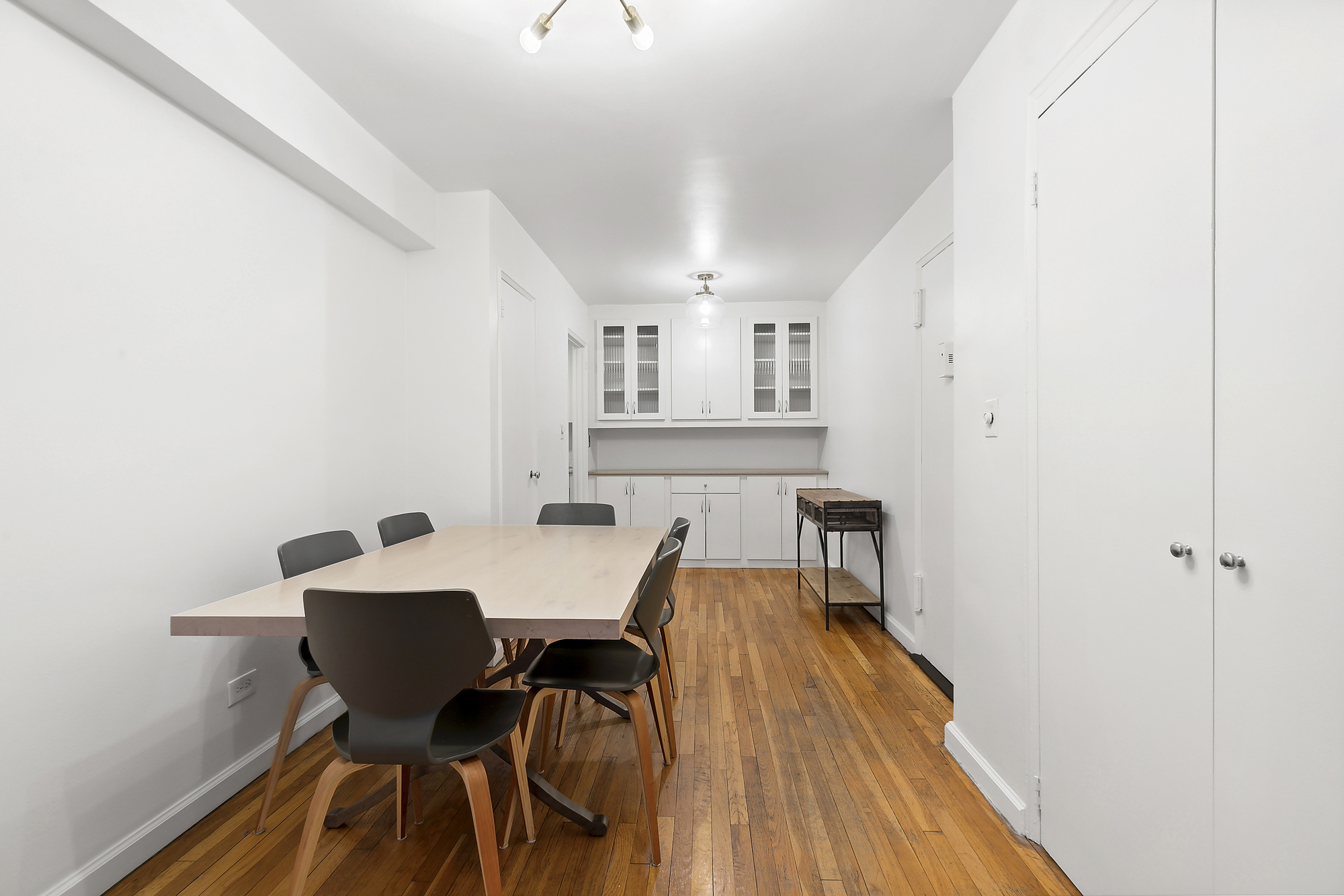 157 East 18th Street, Unit 4H Manhattan, NY 10003 - Photo 2 of 7 a view of a dining room with furniture and wooden floor
