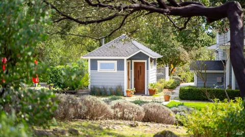 a front view of a house with garden