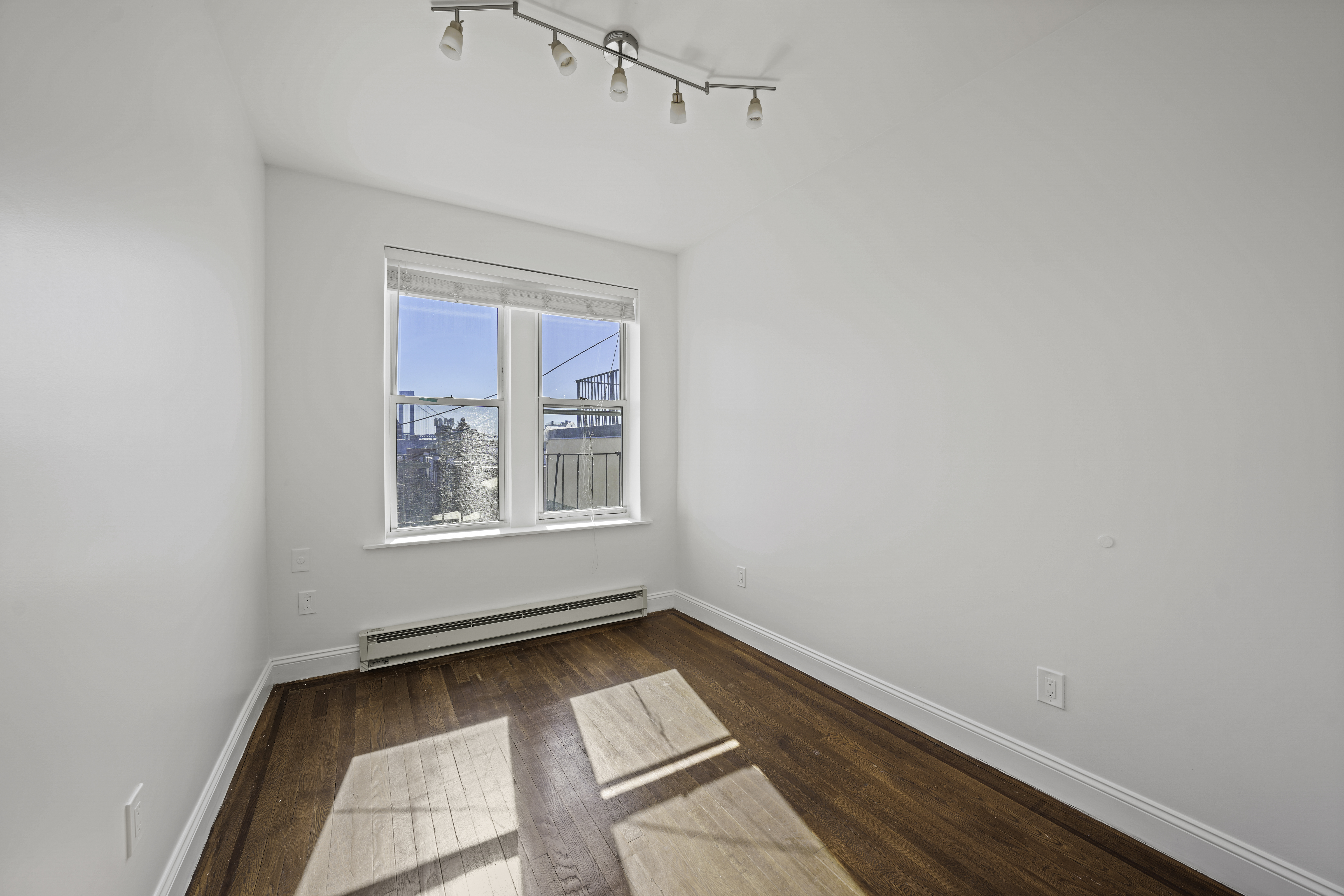 514 86th Street, Unit 4 Brooklyn, NY 11209 - Photo 16 of 19 a view of room with window and hardwood floor