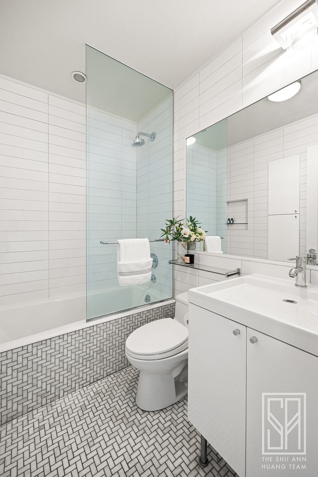 307 7th Street, Unit 4L Brooklyn, NY 11215 - Photo 11 of 15 a bathroom with a sink a toilet and a shower