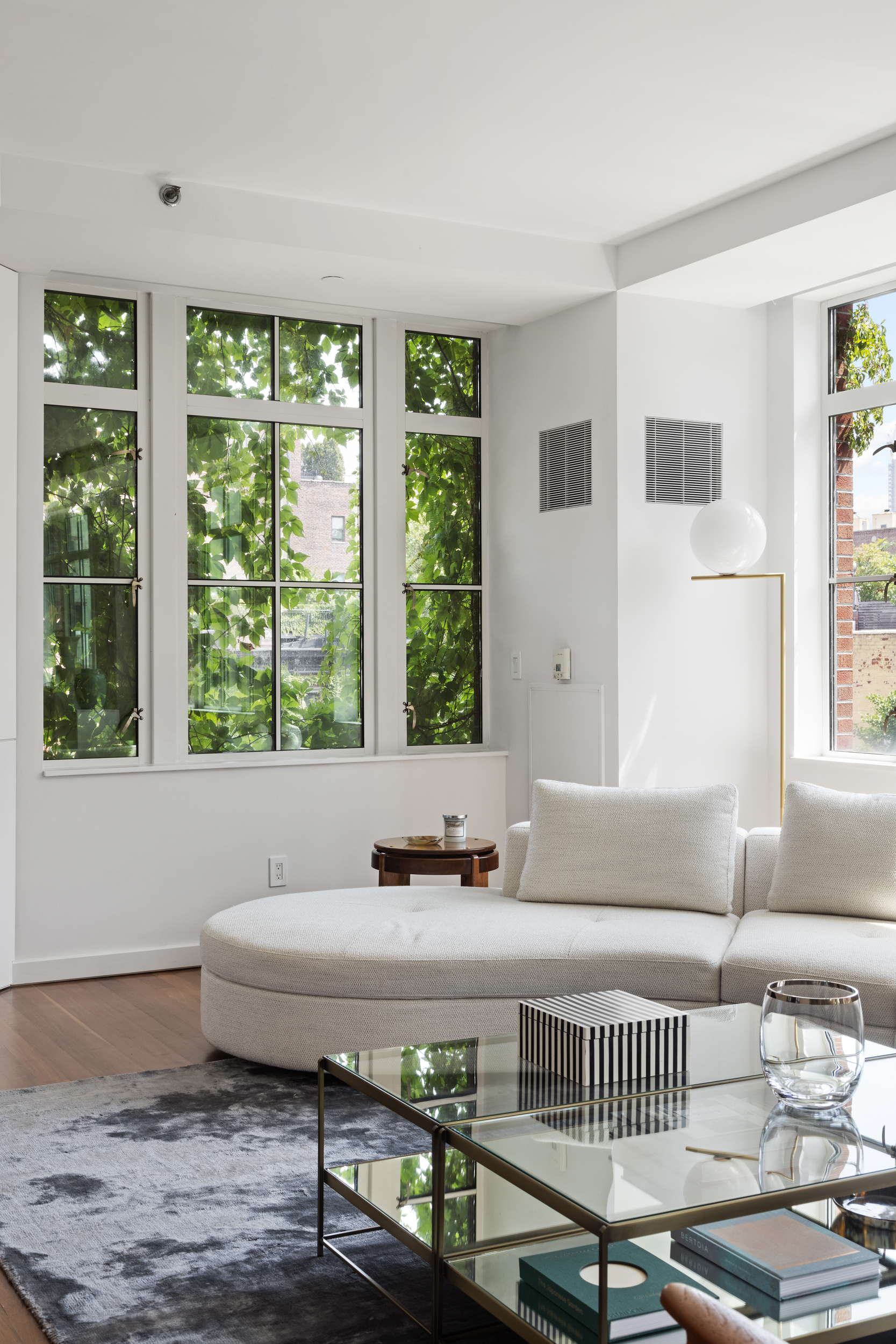 744 Greenwich Street, Unit 4 Manhattan, NY 10014 - Photo 18 of 34 a living room with a window and a couch