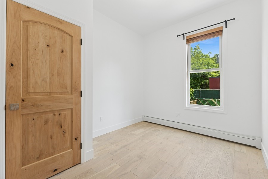 144 Somers Street, Unit 2 Brooklyn, NY 11233 - Photo 3 of 10 an empty room with windows