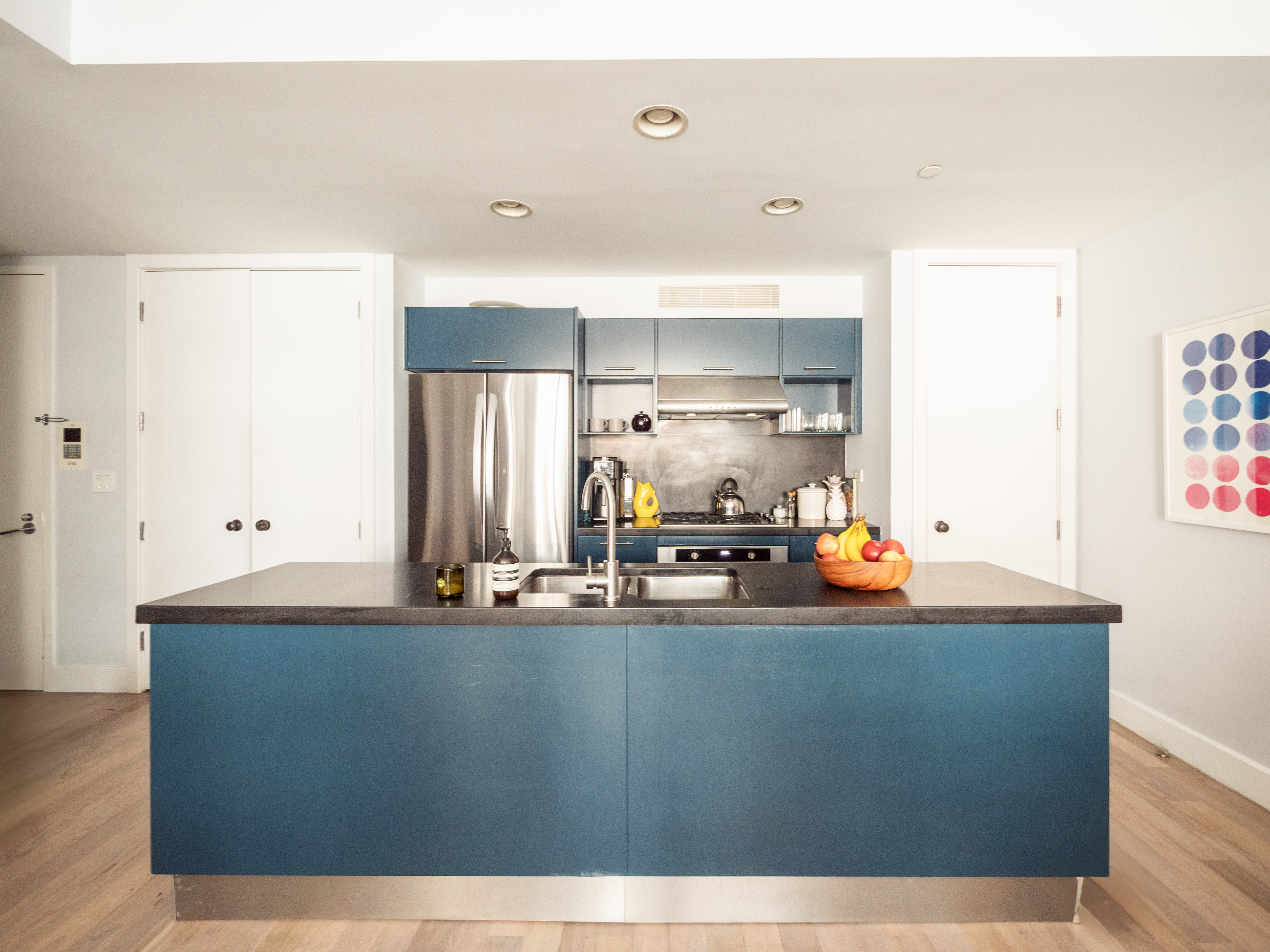 84 Front Street, Unit 5E Brooklyn, NY 11201 - Photo 2 of 11 a room with kitchen island sink and cabinets