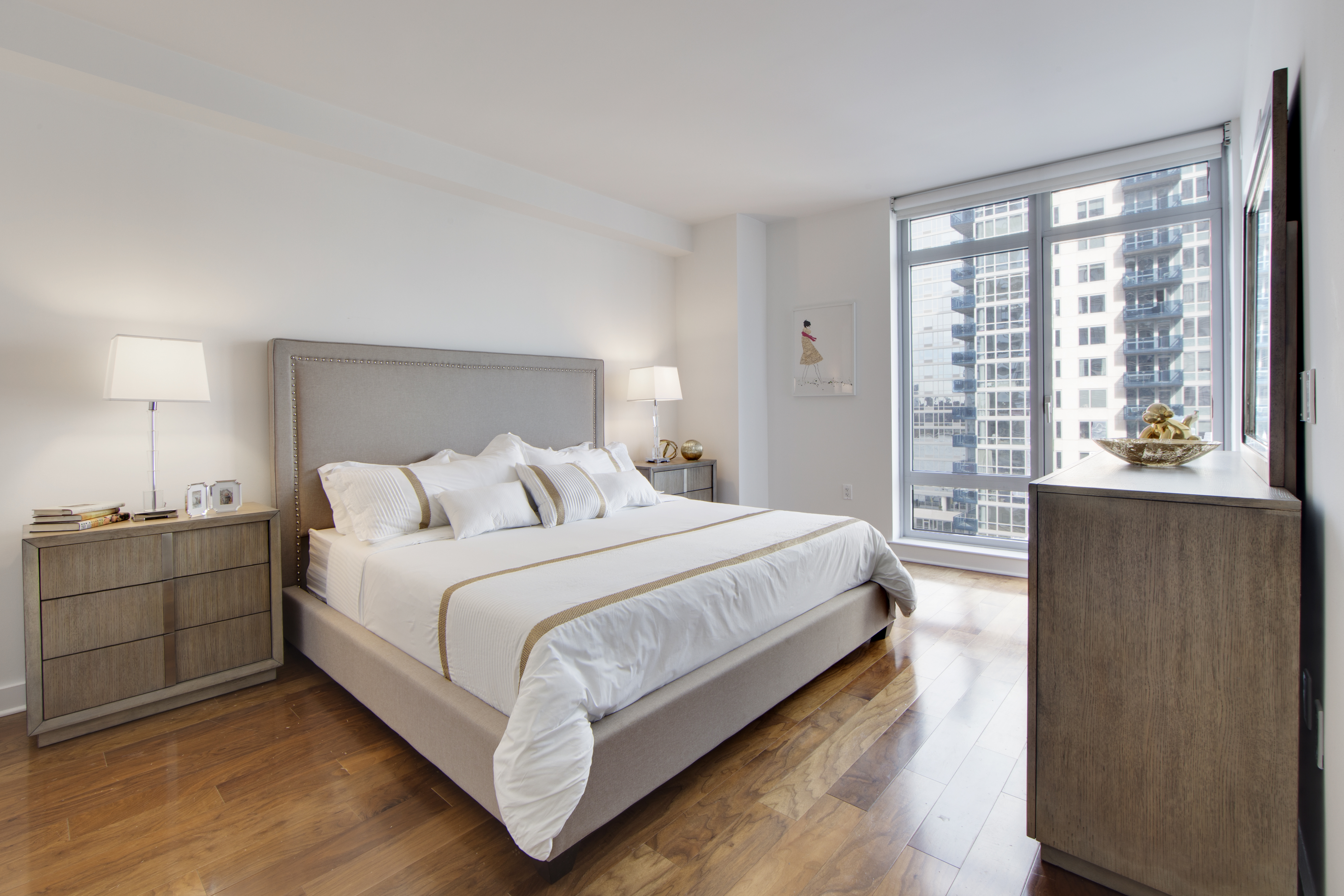 2 Northside Piers, Unit 8H Brooklyn, NY 11249 - Photo 9 of 20 a bedroom with a bed and a night stand