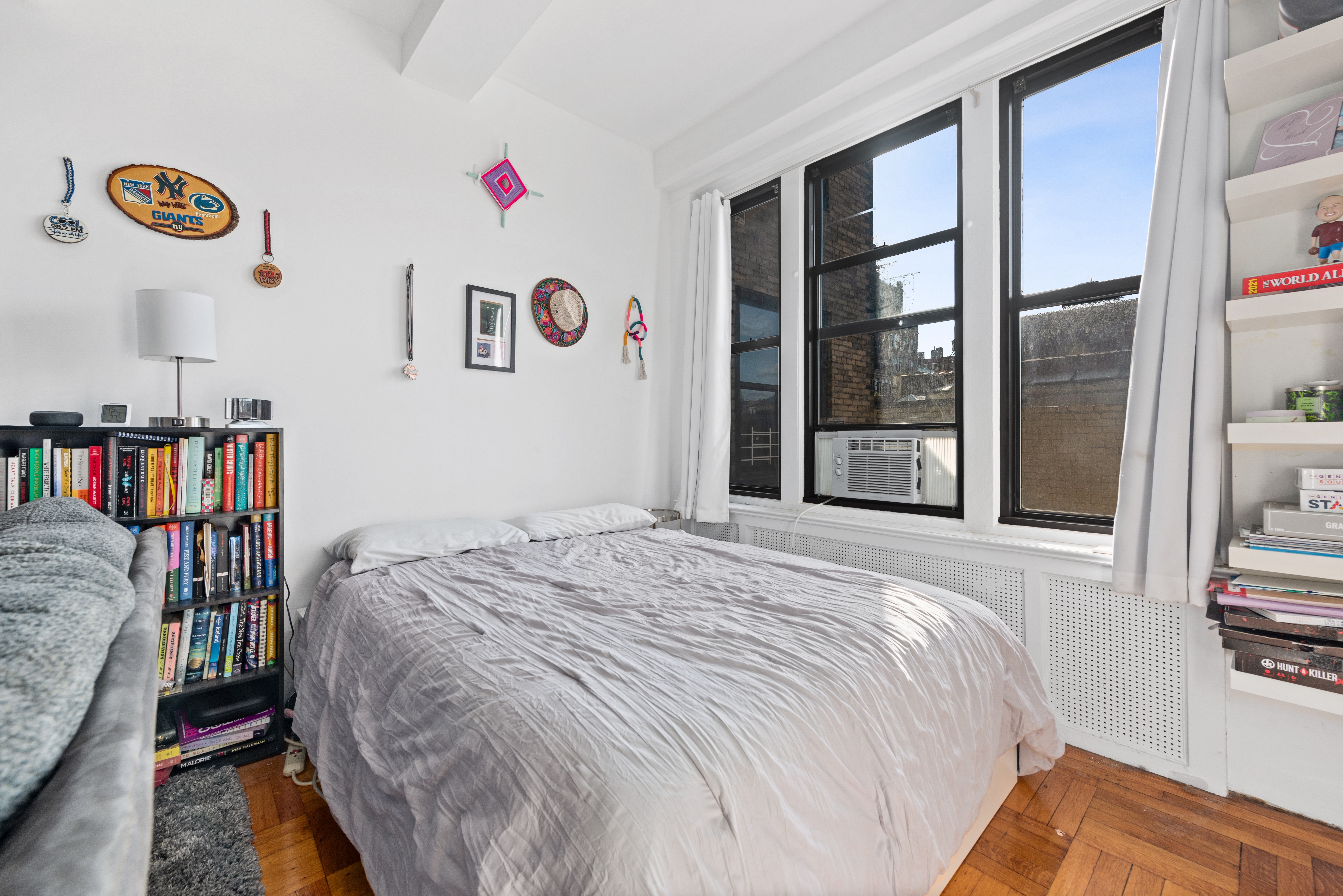 225 Central Park West, Unit 619 Manhattan, NY 10024 - Photo 3 of 6 a bed sitting in a bedroom next to a window