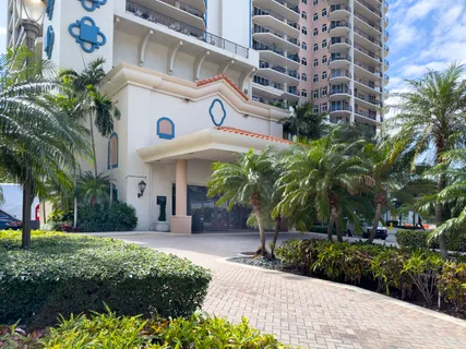 a front view of a building with garden