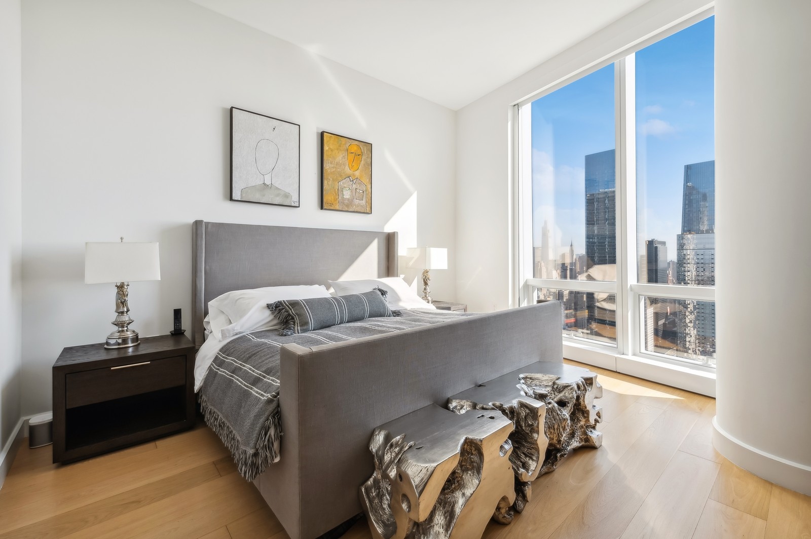 15 Hudson Yards, Unit 74F Manhattan, NY 10001 - Photo 6 of 13 a bedroom with a bed and wooden floor