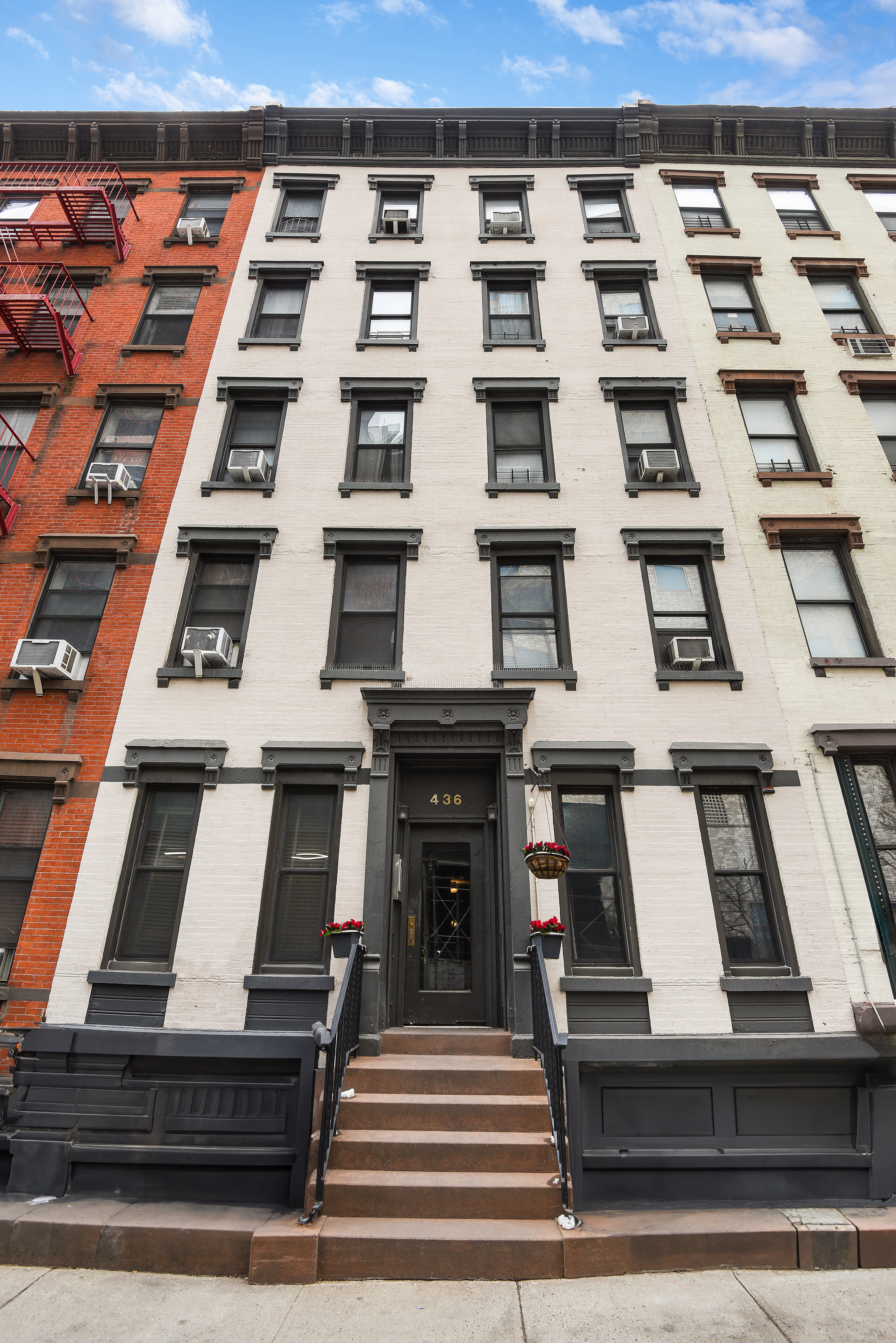 436 East 66th Street, Unit 1W Manhattan, NY 10065 - Photo 16 of 19 a view of a building with many windows