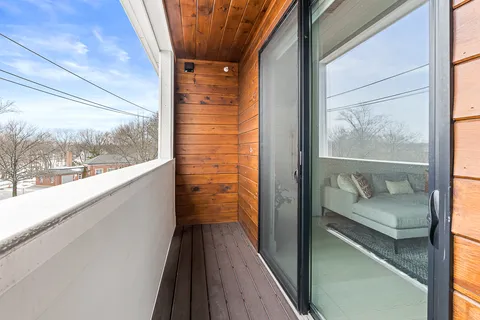 a balcony with view of outdoor space