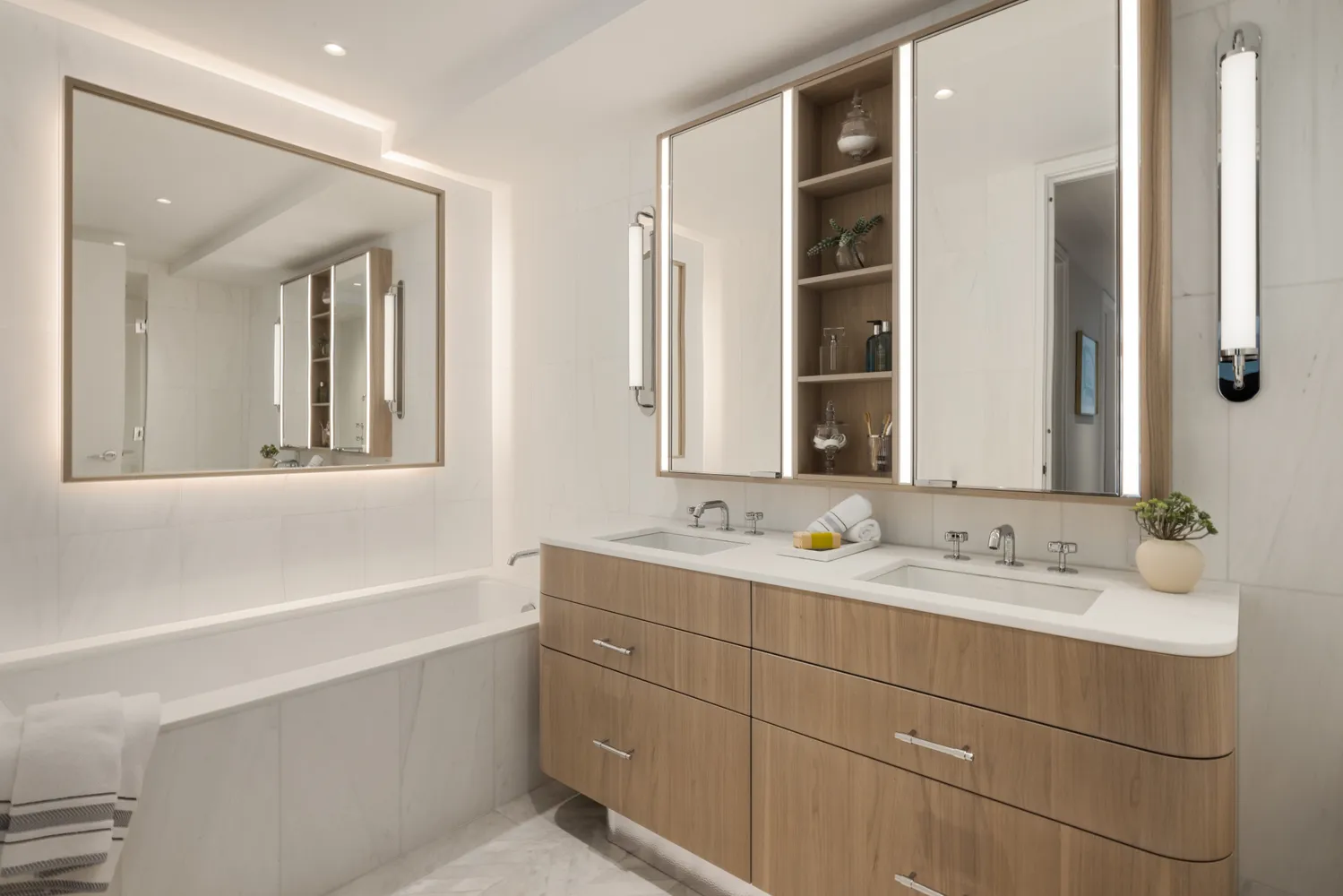 a bathroom with a double vanity sink mirror and double