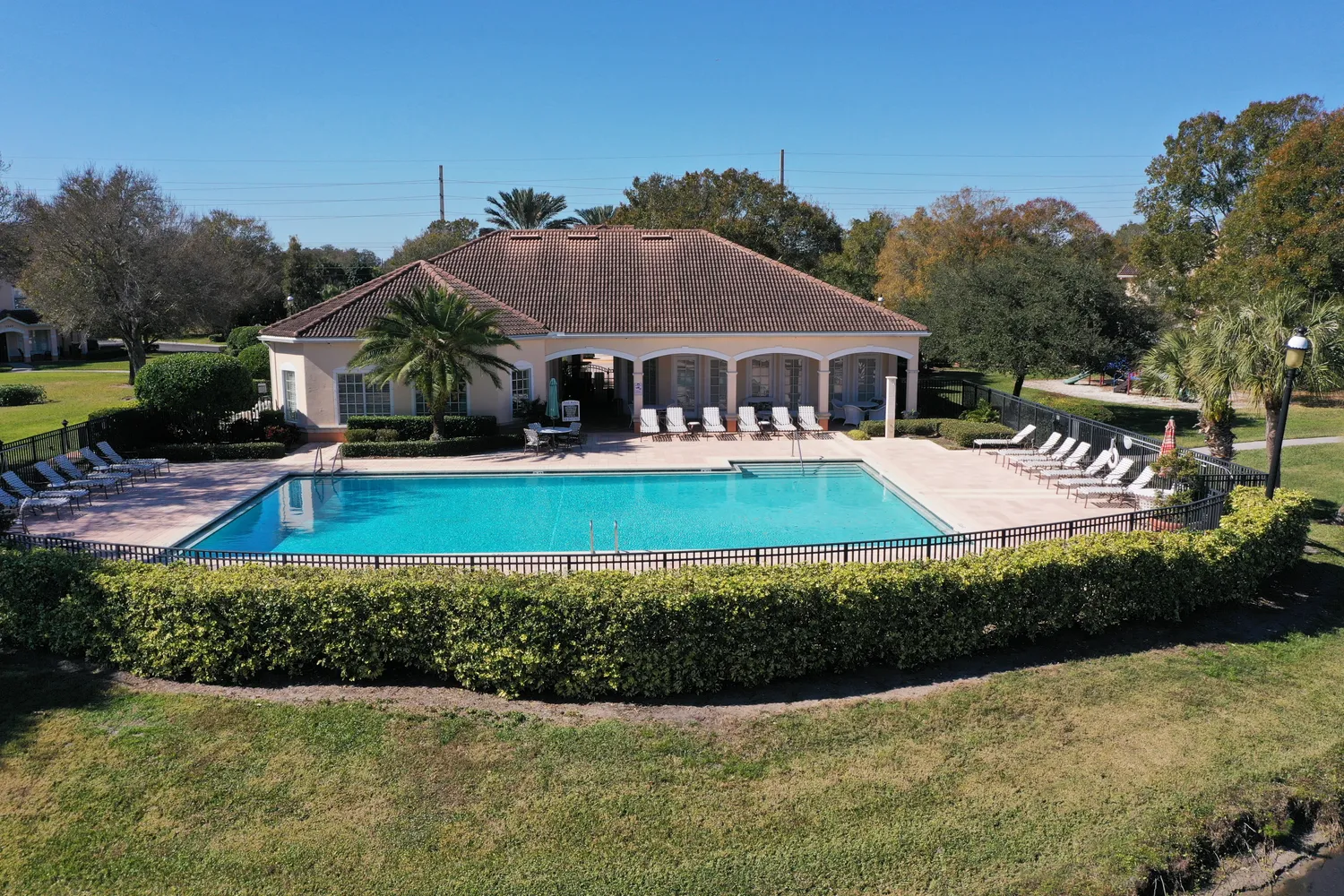 a view of a swimming pool with an outdoor seating and a yard