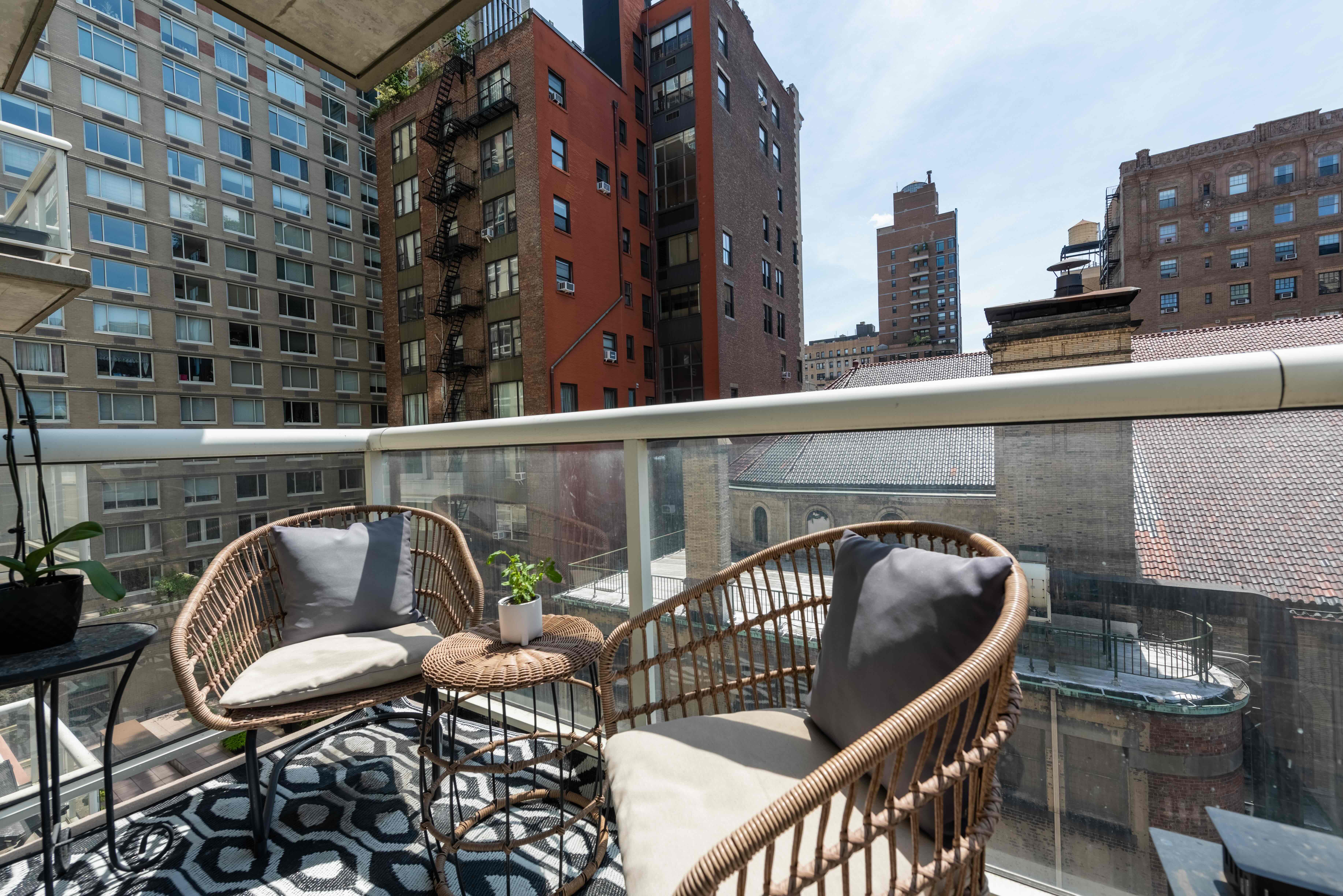 2373 Broadway, Unit 630 Manhattan, NY 10024 - Photo 6 of 17 a balcony with table and chairs